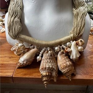 SHELL NECKLACE ON TWINE WITH GOLD ACCENTS